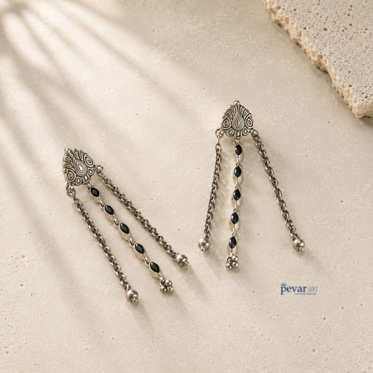 pevar925 oxidized 925 sterling silver dangle earrings with black oval stones, floral clusters, and intricate carvings.