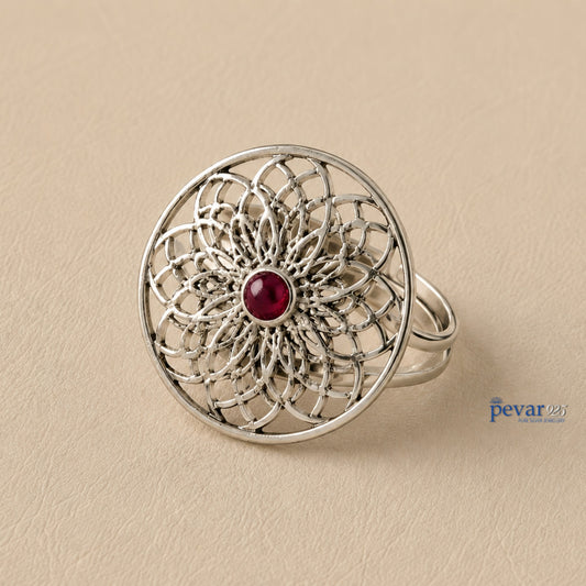 pevar925 oxidized sterling silver adjustable ring featuring a circular floral filigree motif with a central red stone