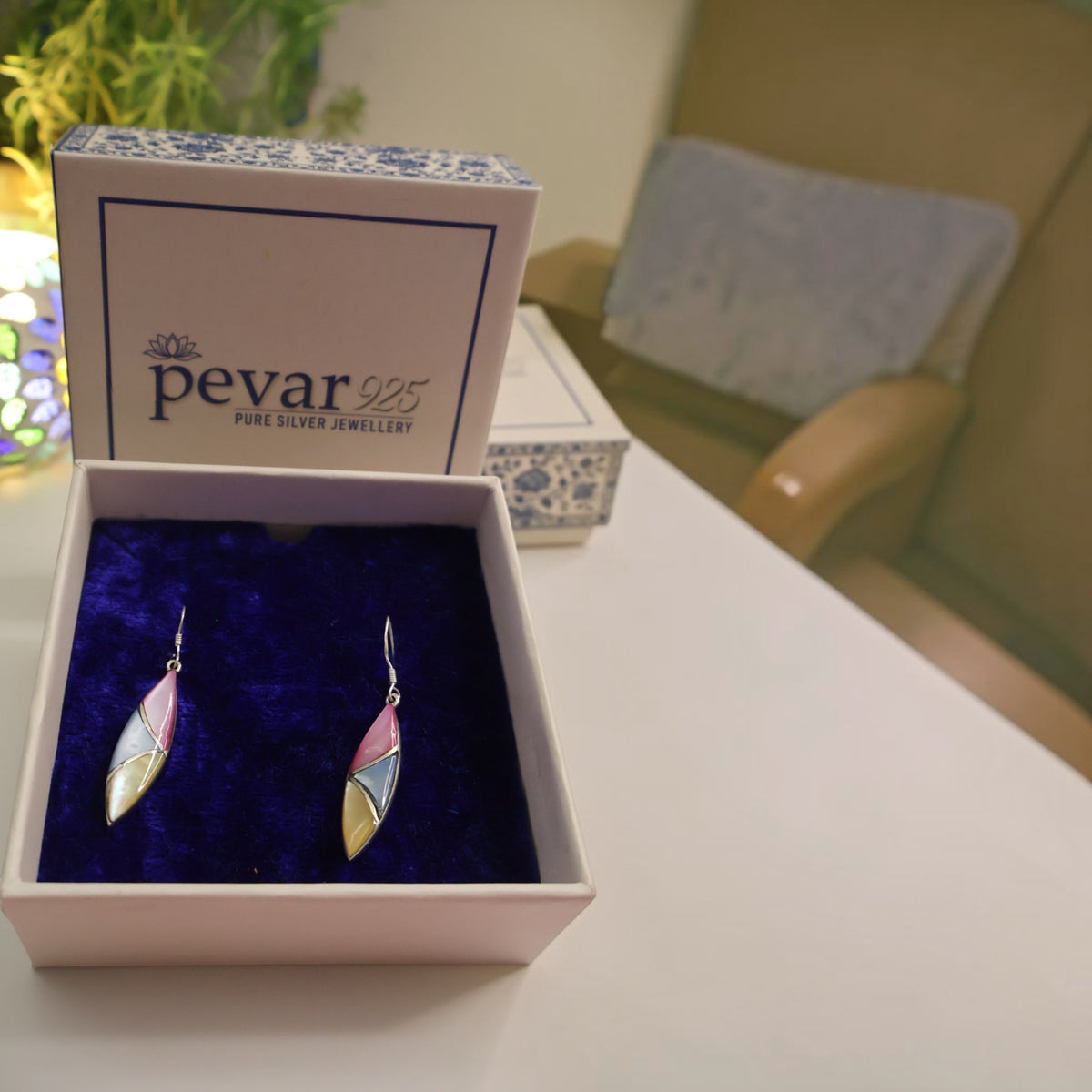 pevar925 oxidized silver tri-color leaf hook earrings displayed in a blue velvet-lined gift box.