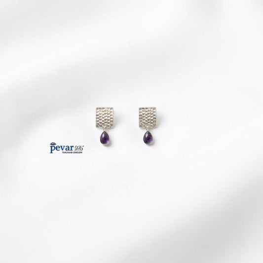 pevar925 oxidized silver earrings featuring a textured rectangular stud and a dangling purple teardrop stone