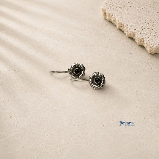 pevar925 oxidized 925 silver drop earrings featuring delicate rose flower motifs with black stone centers.