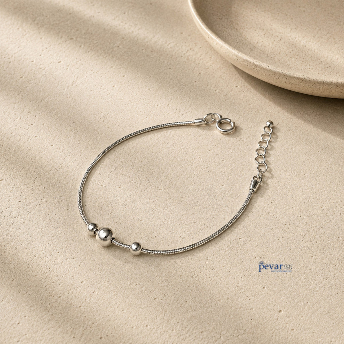 pevar925 kids charm bracelet in rhodium-plated sterling silver with three polished beads on a delicate chain