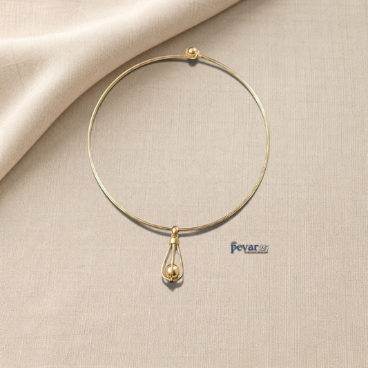 pevar925 gold-toned hasli necklace featuring a minimalist circular band and an elongated cage pendant with a bead.