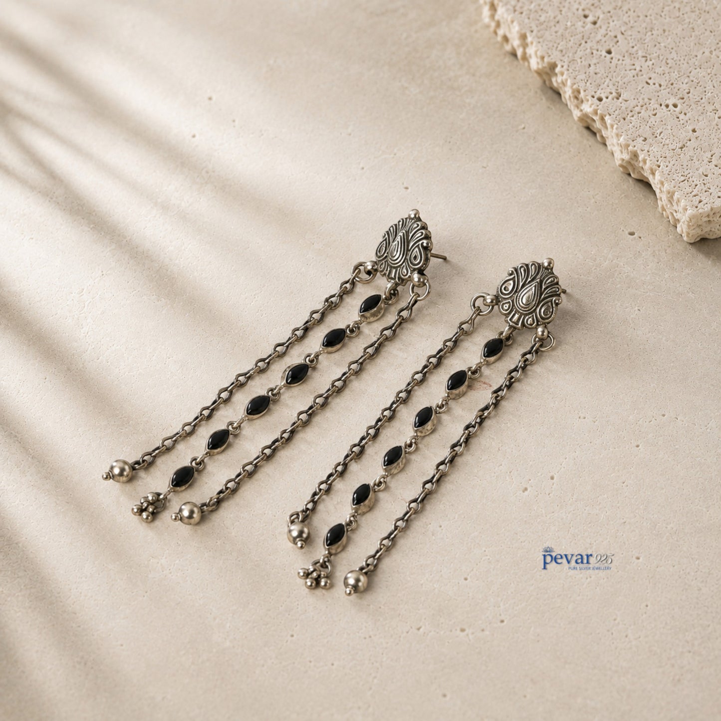 pevar925 oxidized 925 sterling silver dangler earrings with black oval stones, floral clusters, and carved motifs.
