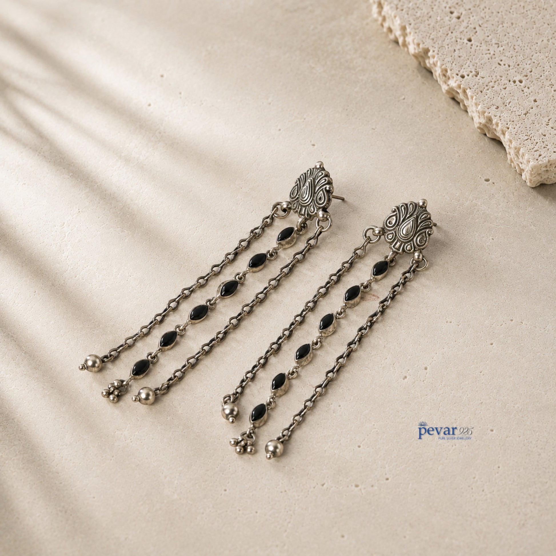 pevar925 oxidized 925 sterling silver dangler earrings with black oval stones, floral clusters, and carved motifs.