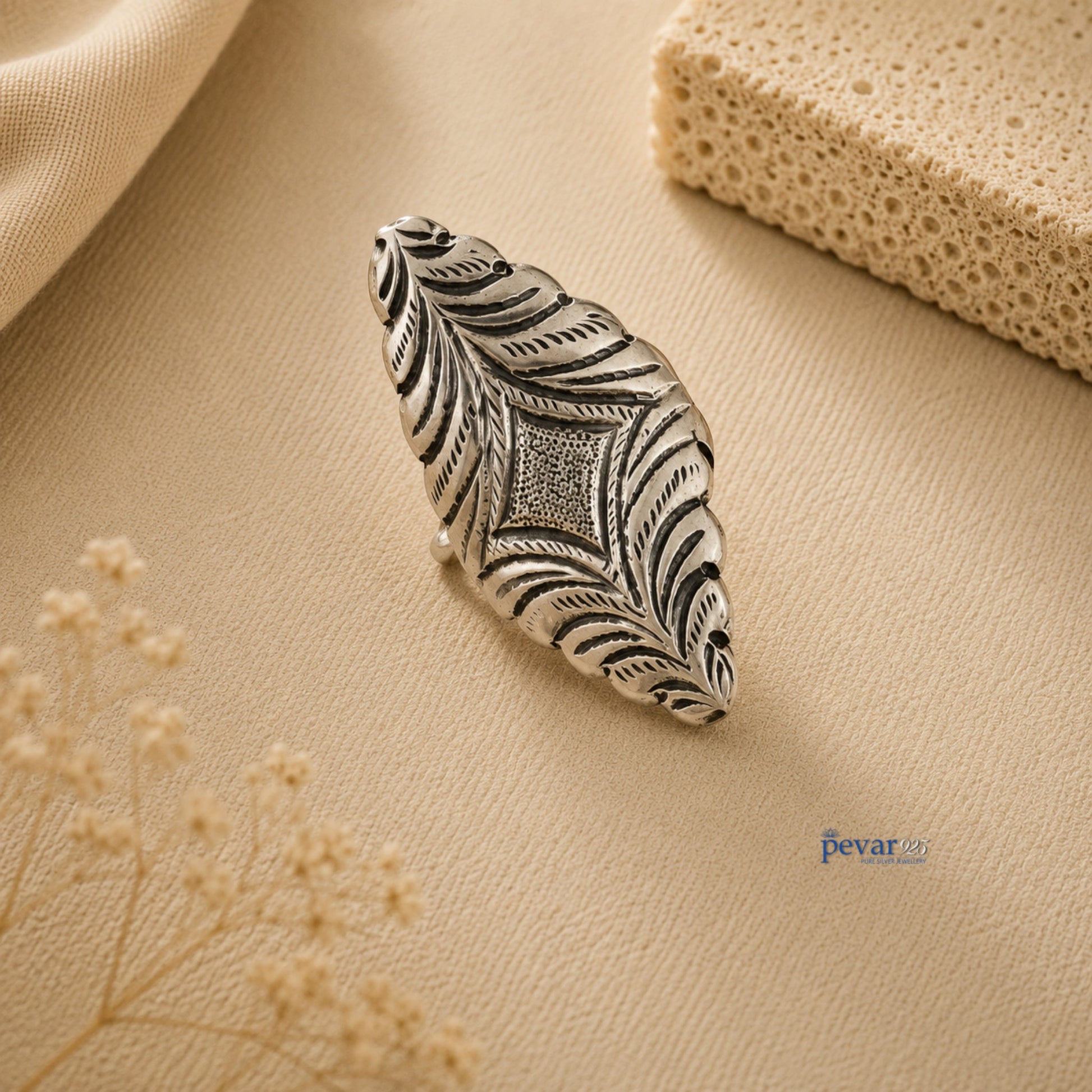 pevar925 oxidized silver adjustable ring with intricate diamond motif and floral chitai engraving on beige background