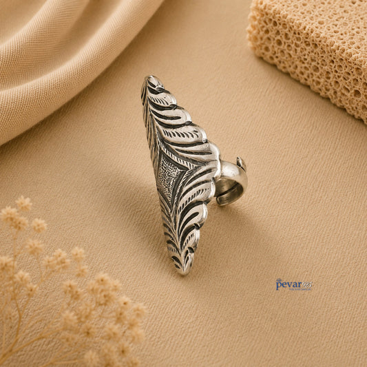 pevar925 oxidized silver adjustable ring with intricate diamond motif chitai engraving on a beige fabric background