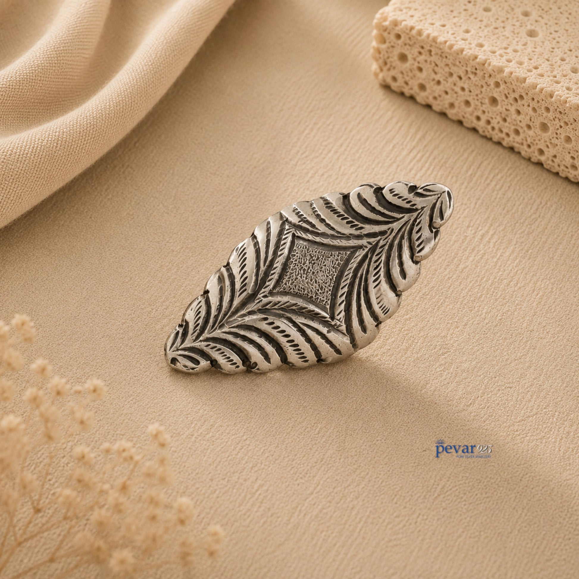 pevar925 oxidized silver adjustable ring with intricate diamond motif and floral chitai engraving on beige background