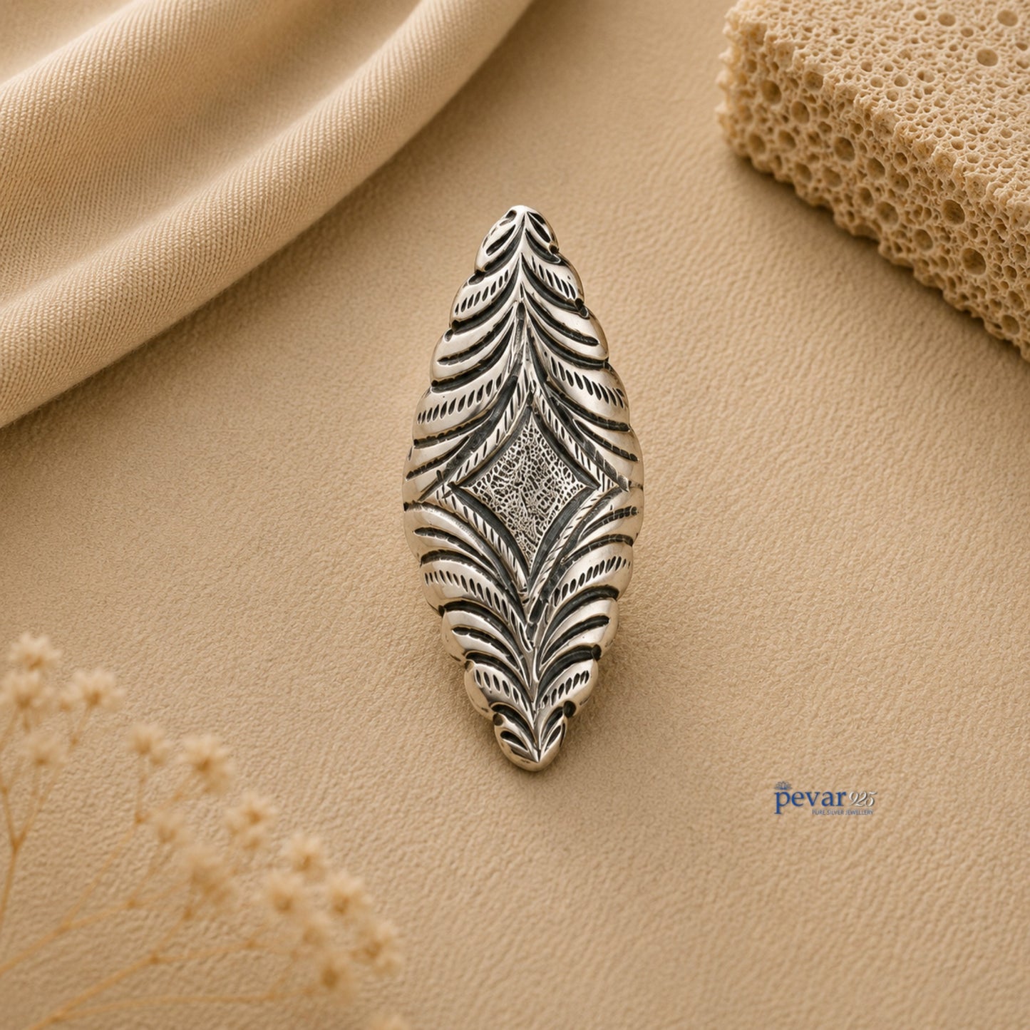 pevar925 oxidized silver adjustable ring featuring an elongated diamond motif with intricate floral chitai engraving.