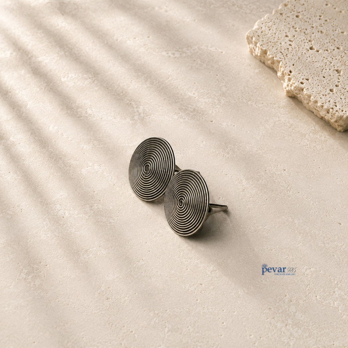 pevar925 oxidized 925 sterling silver stud earrings featuring a minimalist circular disc design with concentric lines.
