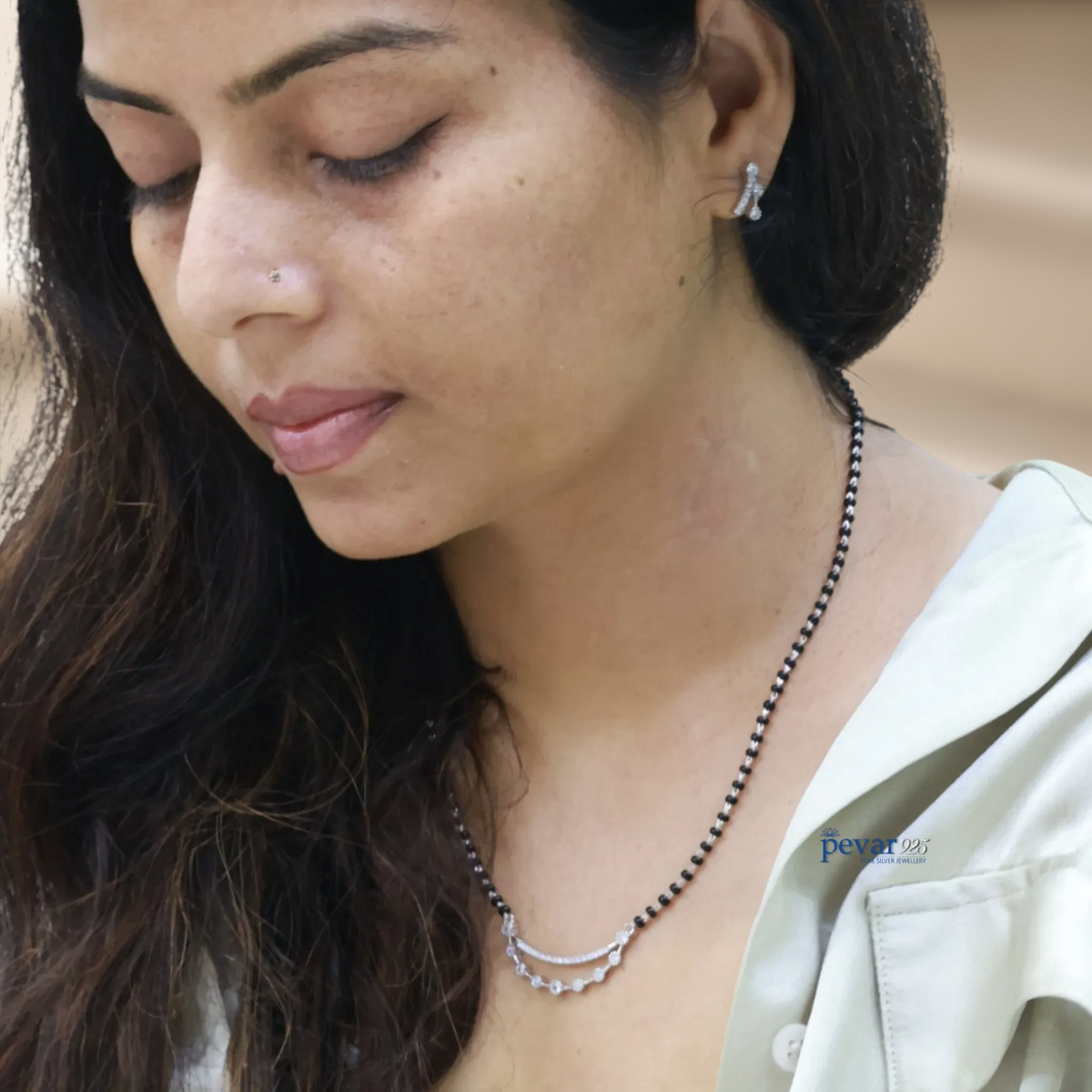 pevar925 oxidized sterling silver double layer mangalsutra with black beads worn by a woman