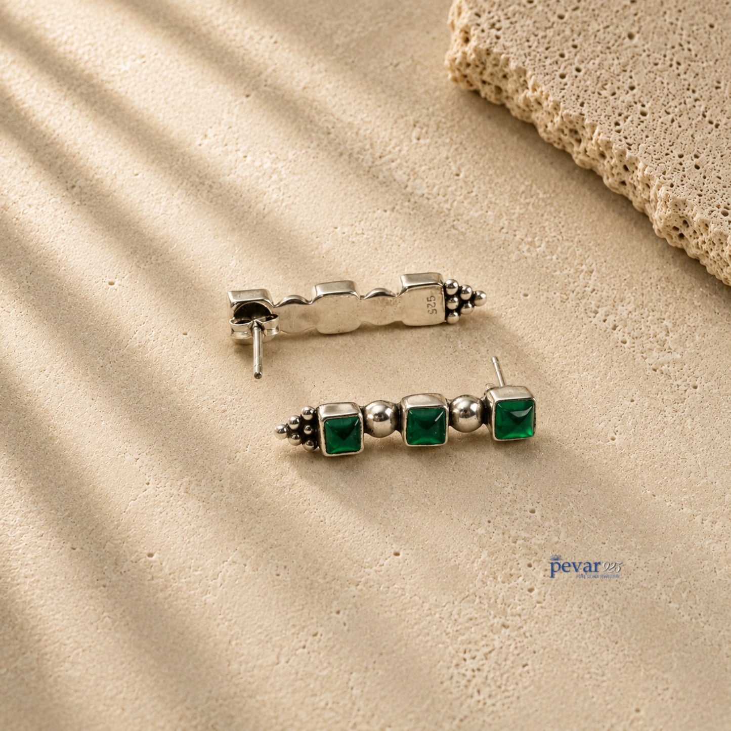 pevar925 oxidized 925 silver trio earrings featuring three square green emerald-colored stones on a textured surface