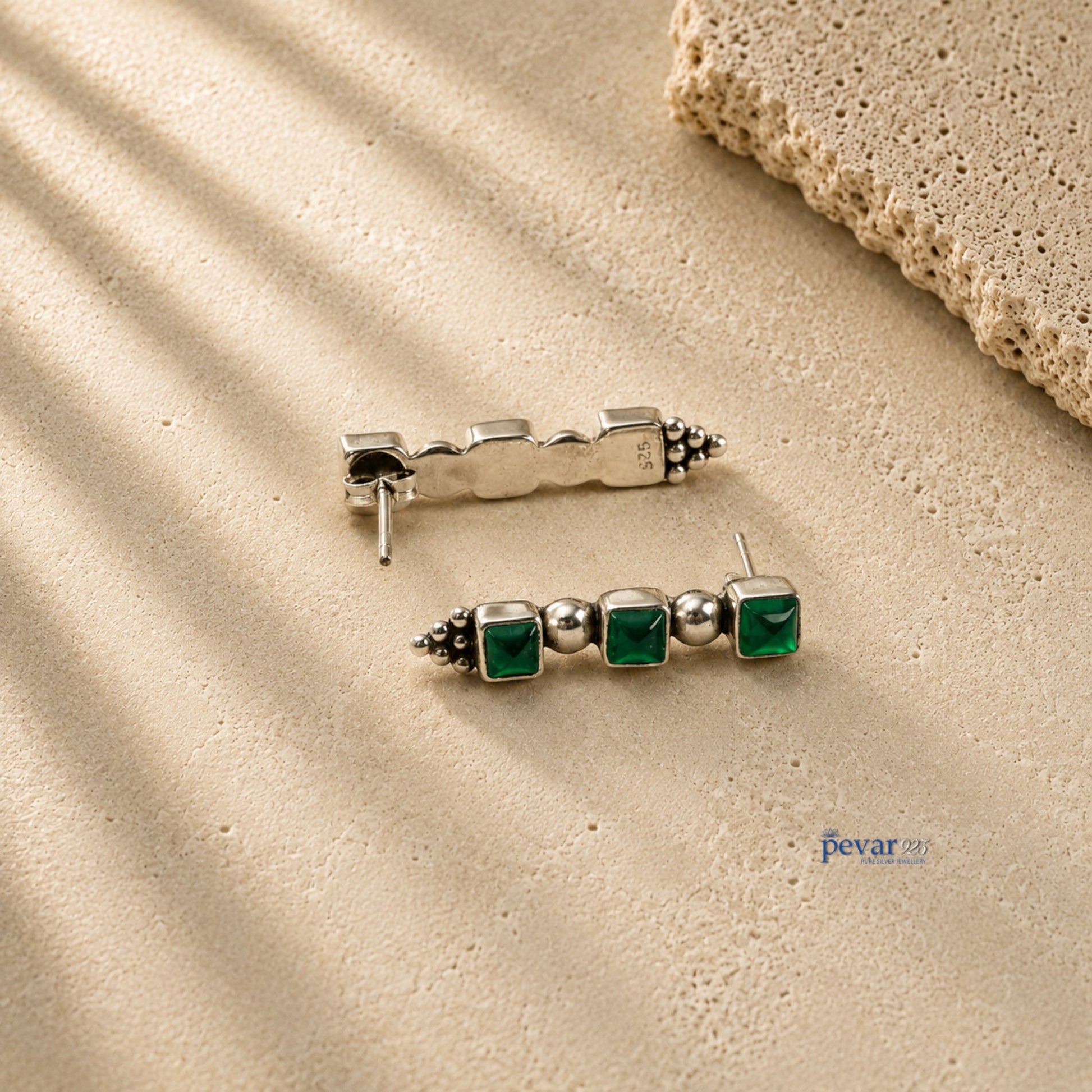 pevar925 oxidized 925 silver trio earrings featuring three square green emerald-colored stones on a textured surface