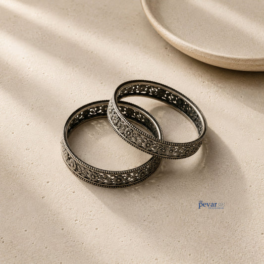 pevar925 oxidized 925 sterling silver bangle featuring intricate floral vine engravings and a beaded rim.