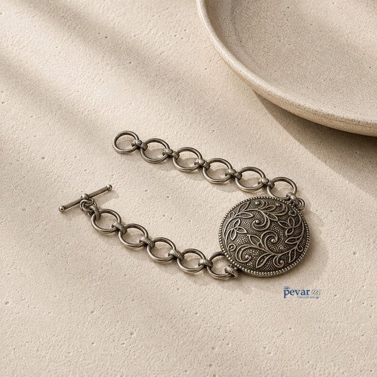pevar925 oxidized 925 sterling silver bracelet featuring an intricate floral medallion with a beaded edge and chain