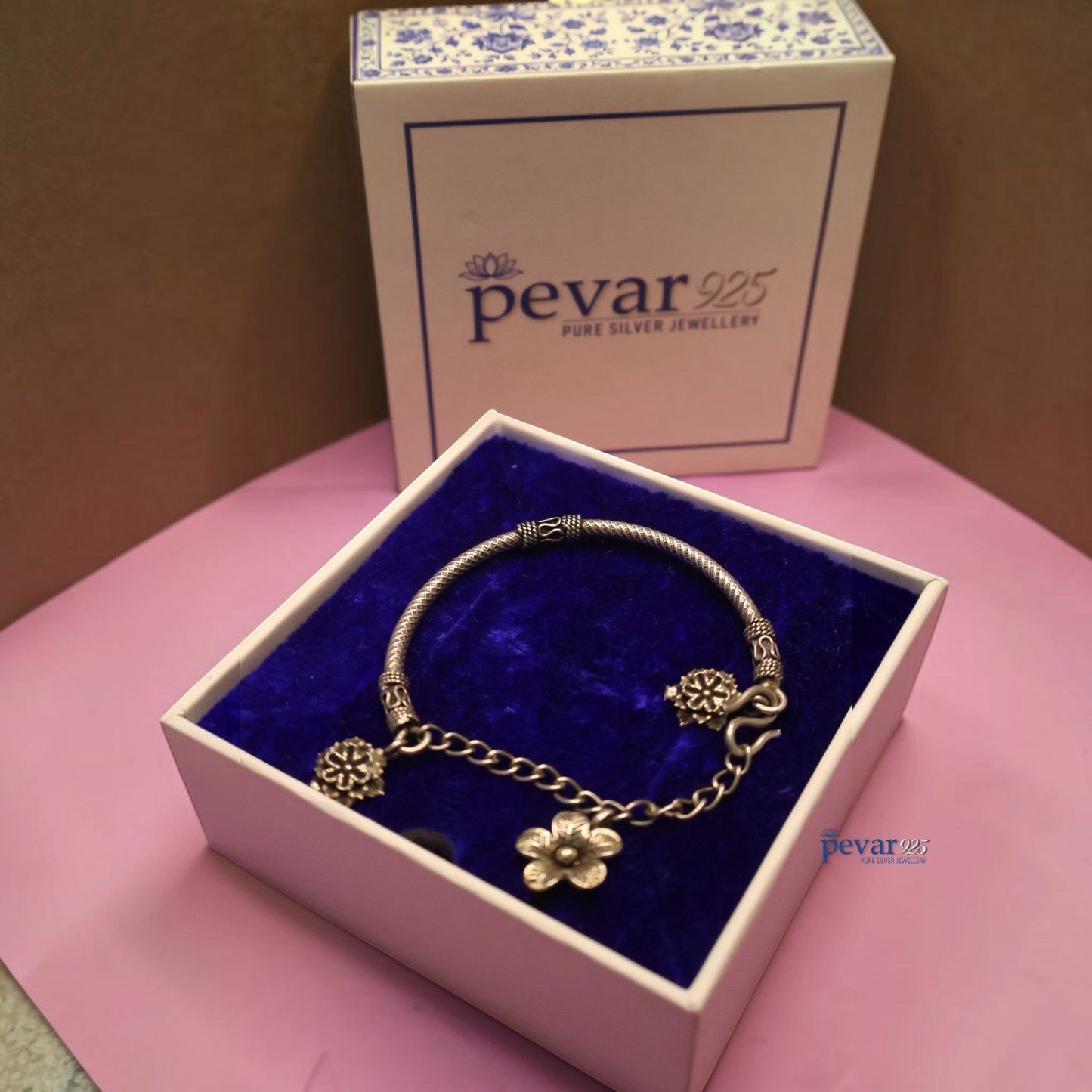 pevar925 oxidized 925 sterling silver floral chain kada bracelet with dangling flower charms in a blue velvet box