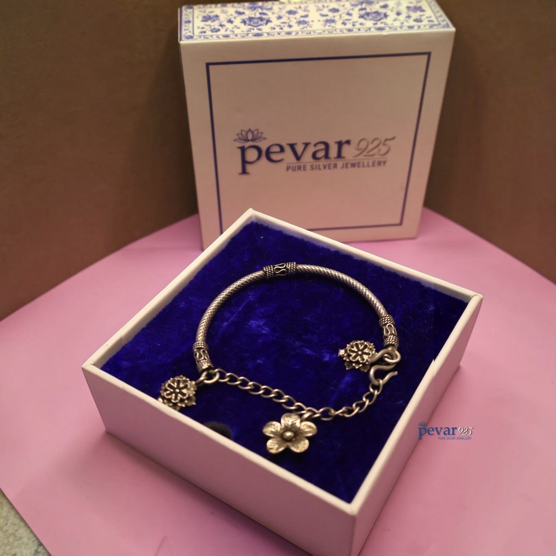 pevar925 oxidized 925 sterling silver floral chain kada bracelet with dangling flower charms in a blue velvet box