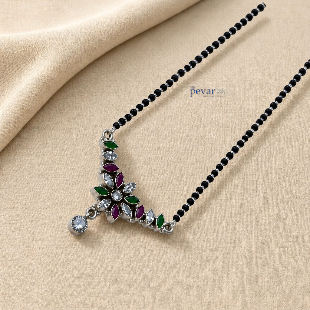 pevar925 oxidized sterling silver mangalsutra with a floral pendant featuring maroon, green, and clear stone accents.
