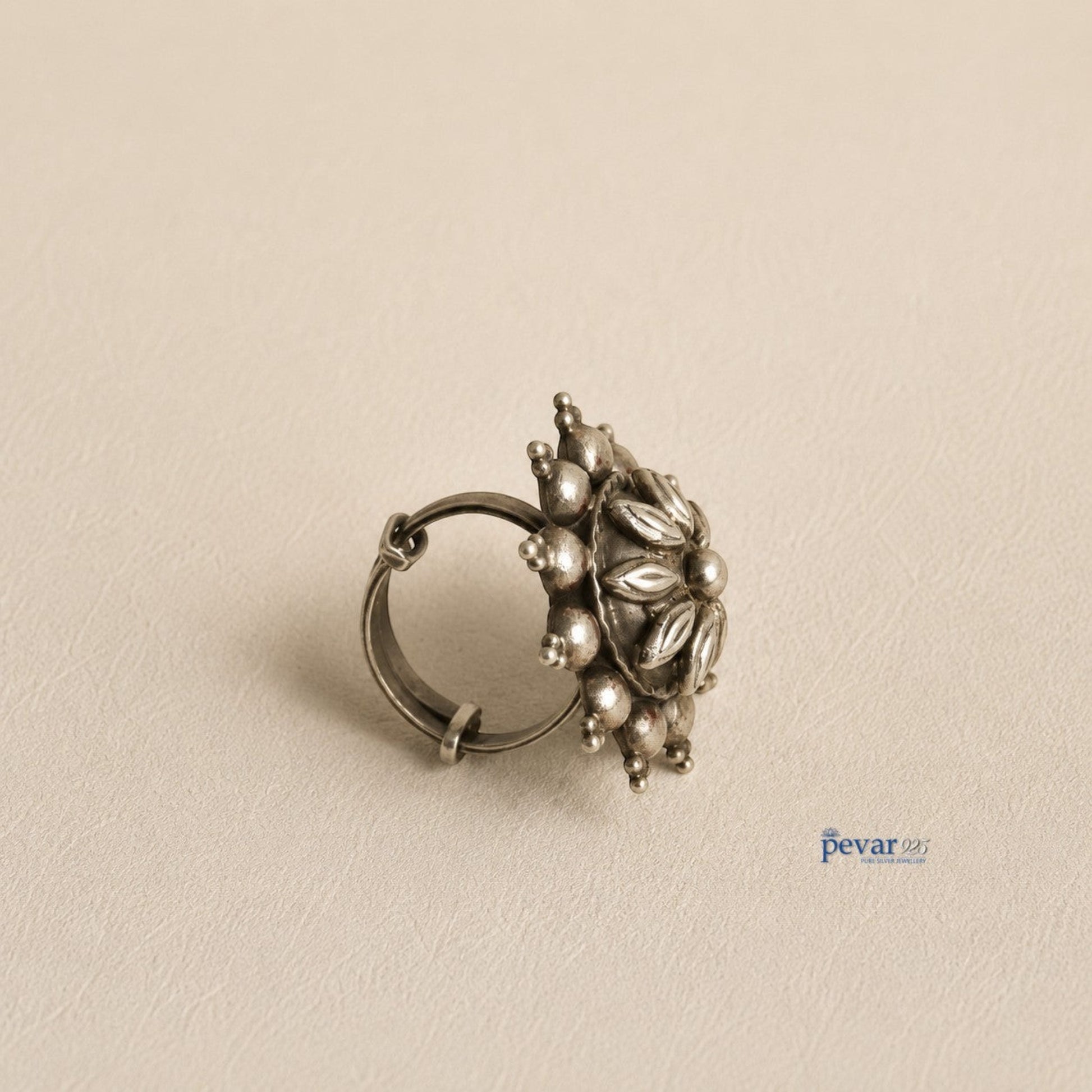 pevar925 oxidized sterling silver adjustable ring featuring a circular floral motif with petal engravings and bead detail