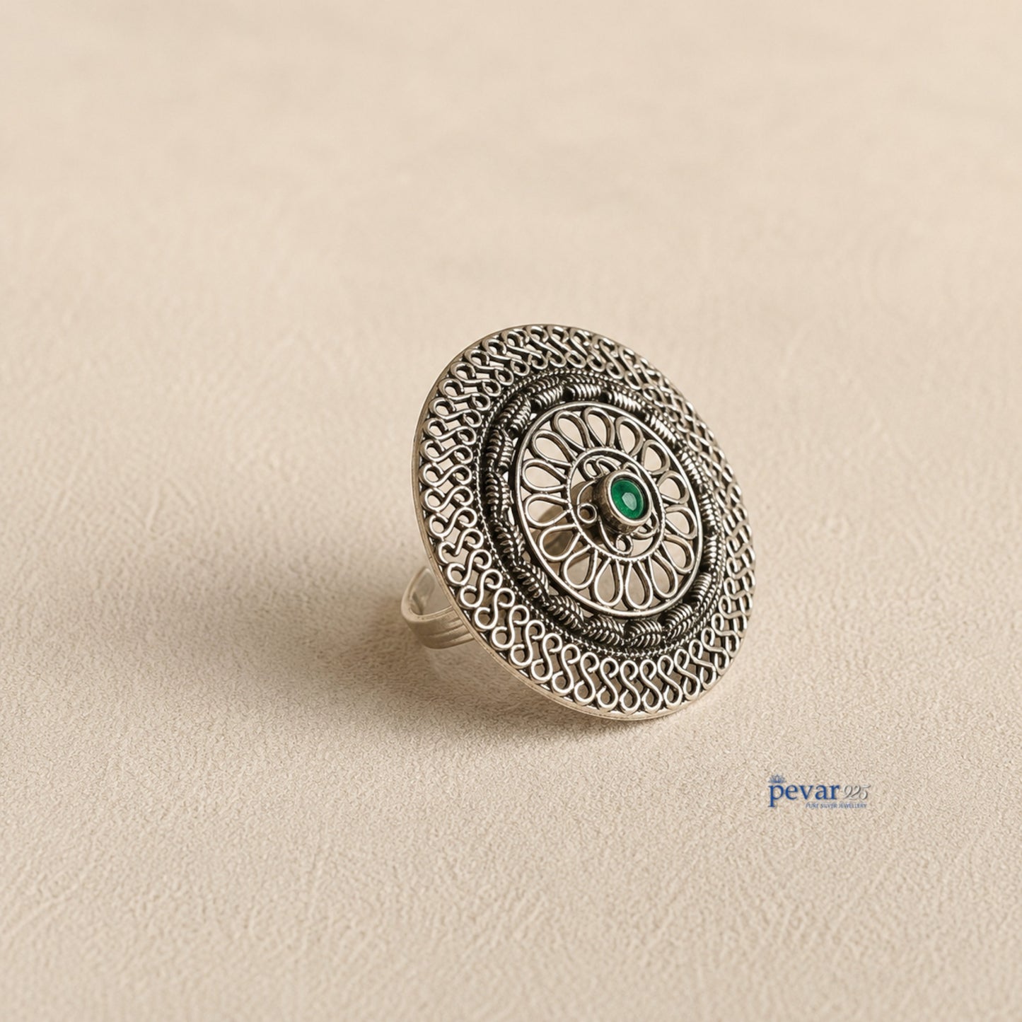 pevar925 oxidized sterling silver adjustable ring featuring a circular floral filigree motif and a central green stone