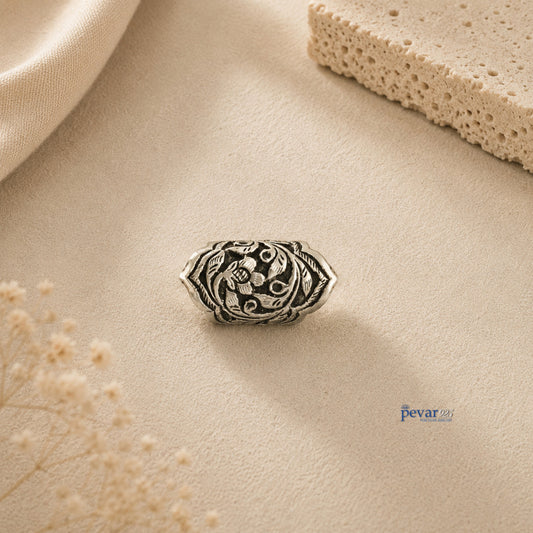 pevar925 oxidized silver adjustable ring featuring intricate floral and leaf chitai engraving on a textured background.