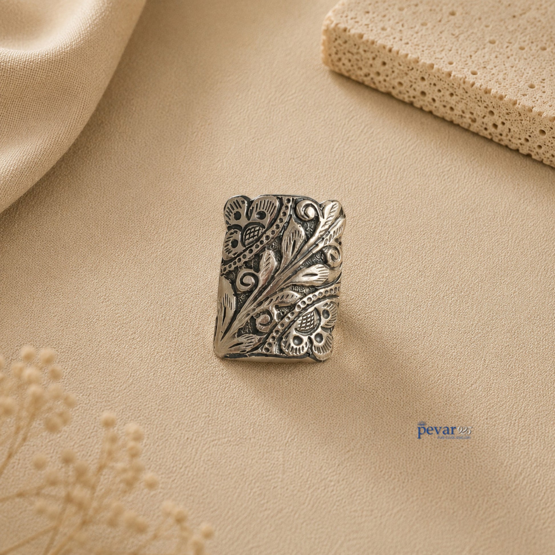 pevar925 oxidized silver rectangular adjustable ring with intricate floral chitai engraving on a neutral background