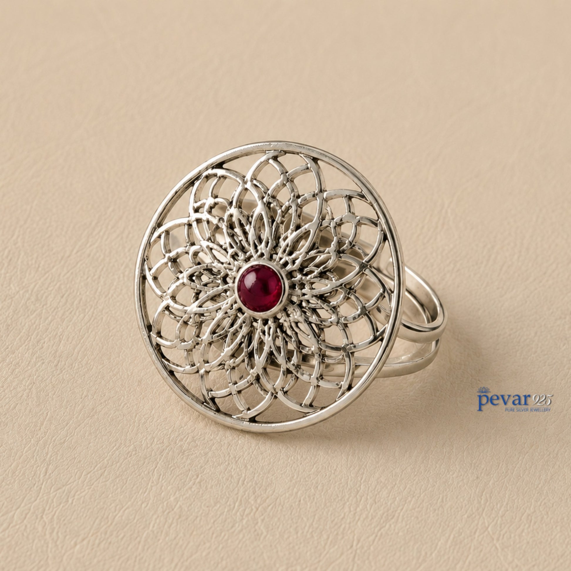 pevar925 oxidized sterling silver adjustable ring featuring a circular floral filigree motif with a central red stone