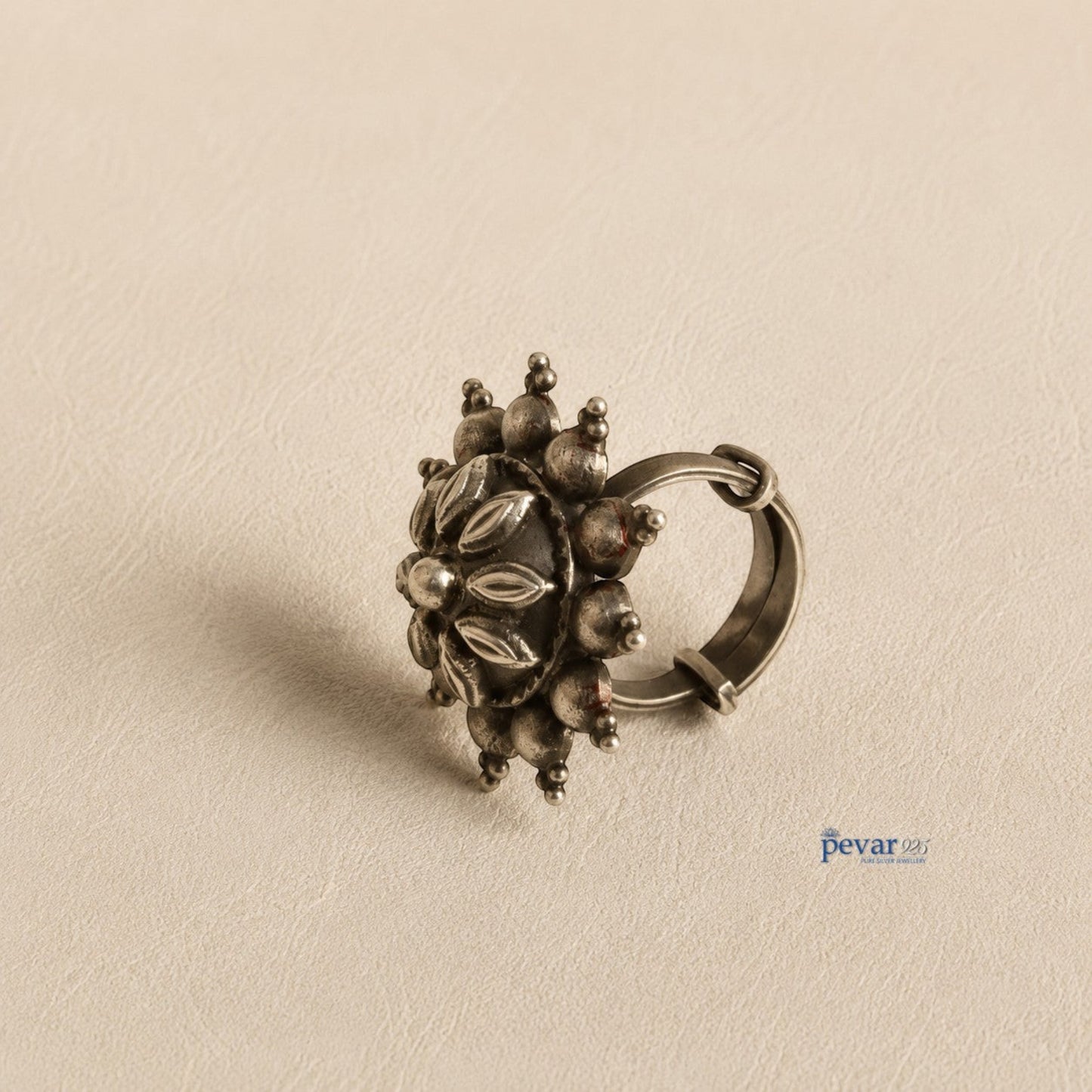 pevar925 oxidized sterling silver adjustable ring featuring a circular floral motif with antique petal engravings