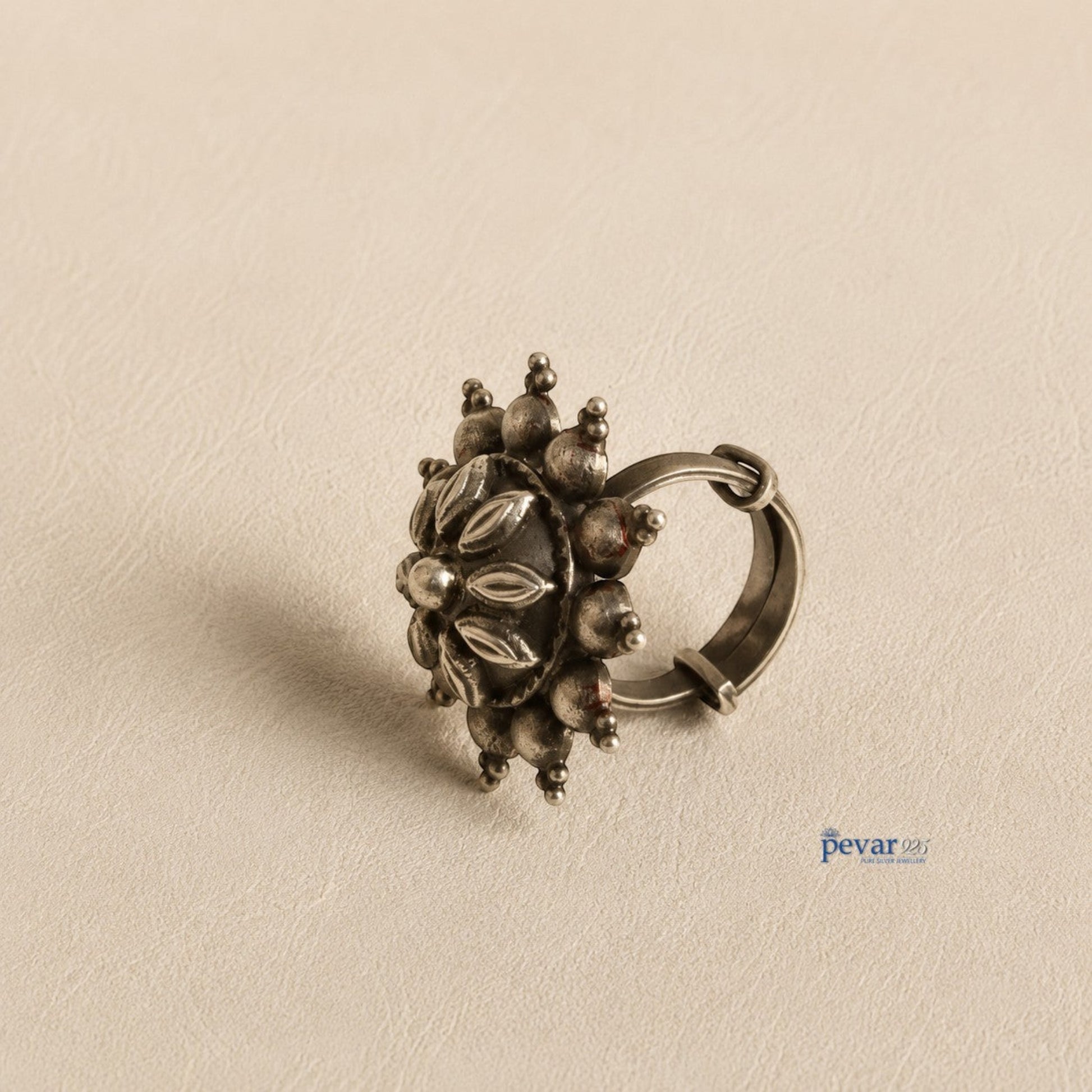 pevar925 oxidized sterling silver adjustable ring featuring a circular floral motif with antique petal engravings