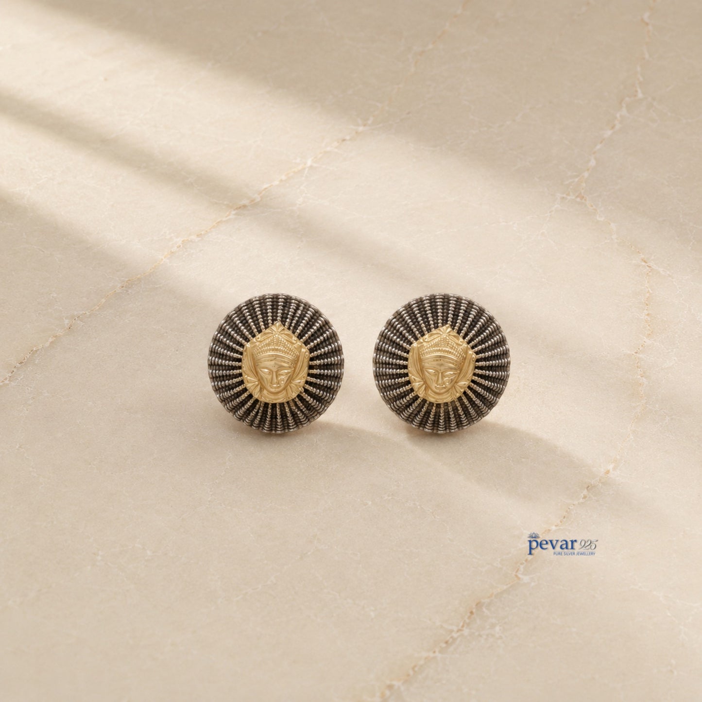 pevar925 oxidized silver round earrings featuring a central golden goddess motif and textured radiating ridges