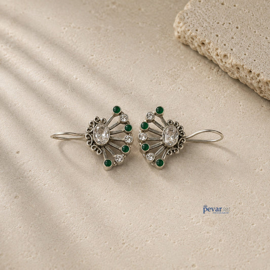pevar925 oxidized 925 silver fan earrings featuring vibrant green stones and clear crystals on a textured stone base.