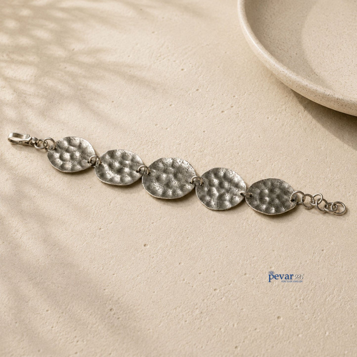 pevar925 oxidized sterling silver bracelet featuring a series of hammered circular discs on a fine chain