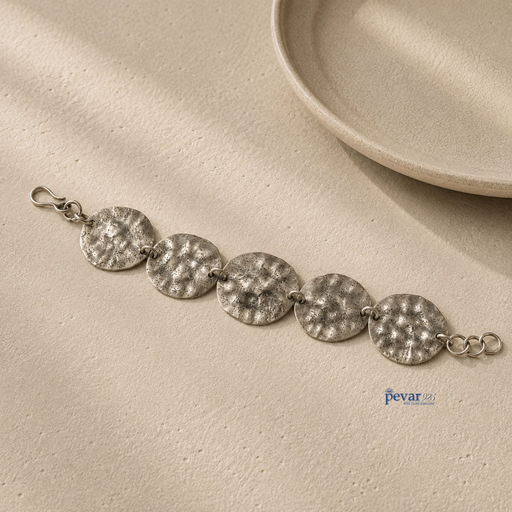 pevar925 oxidized sterling silver bracelet featuring five rustic hammered discs on a fine chain with a hook clasp