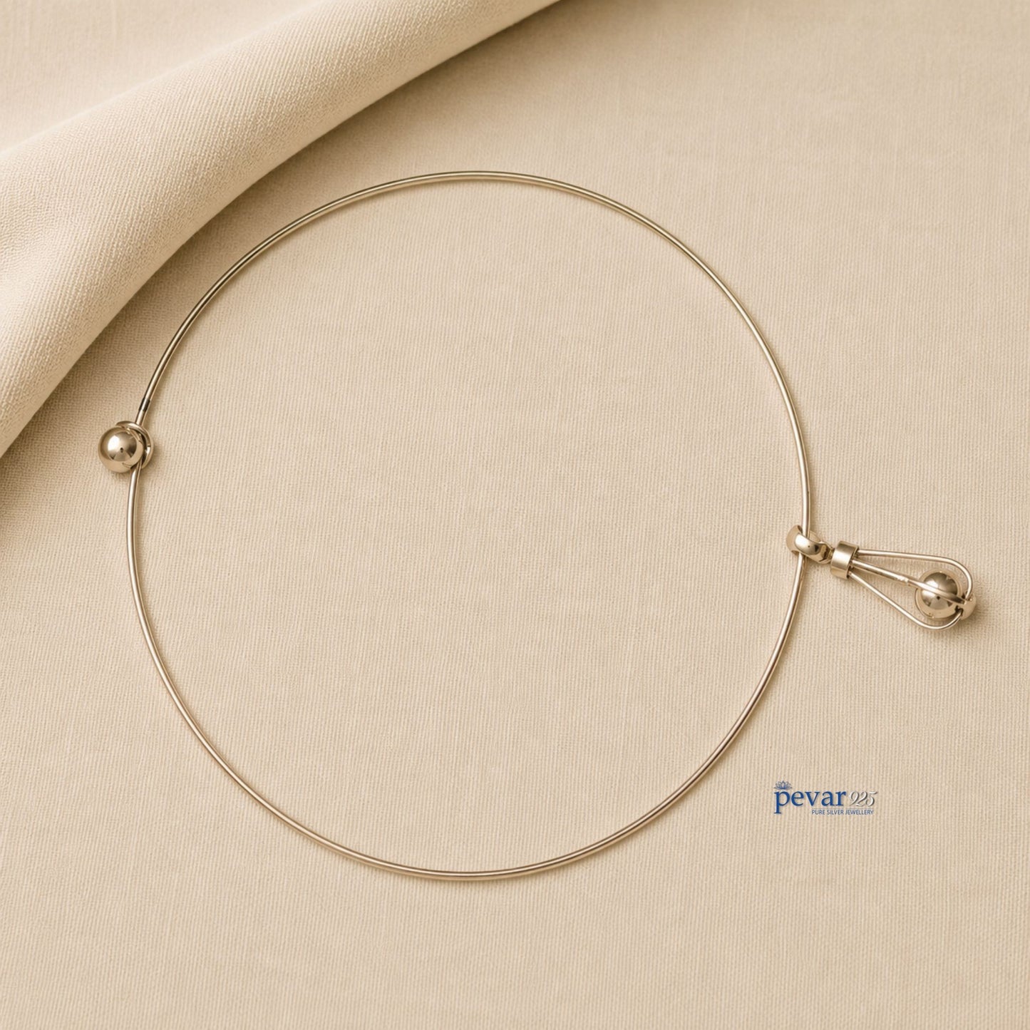 pevar925 oxidized silver hasli necklace featuring a minimalist circular band and an elongated cage pendant with a bead.