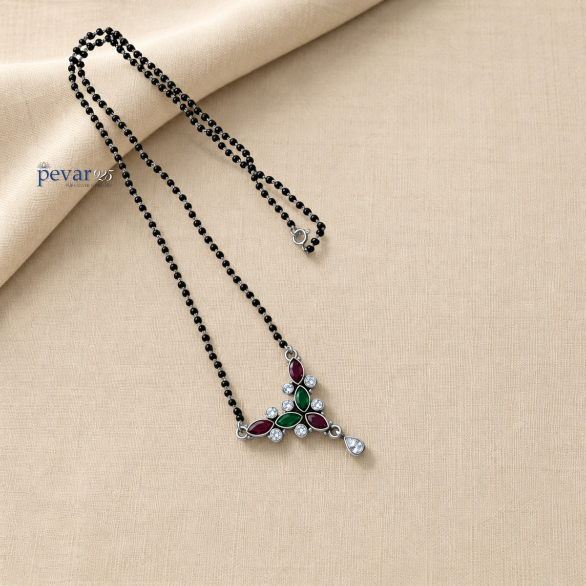 pevar925 oxidized silver mangalsutra with black beads and a maroon and green stone leaf motif pendant