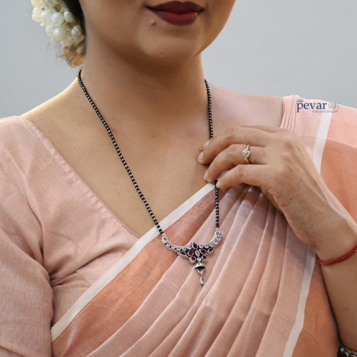 pevar925 oxidized sterling silver mangalsutra with black beads, maroon stones, and a heritage-style floral pendant.