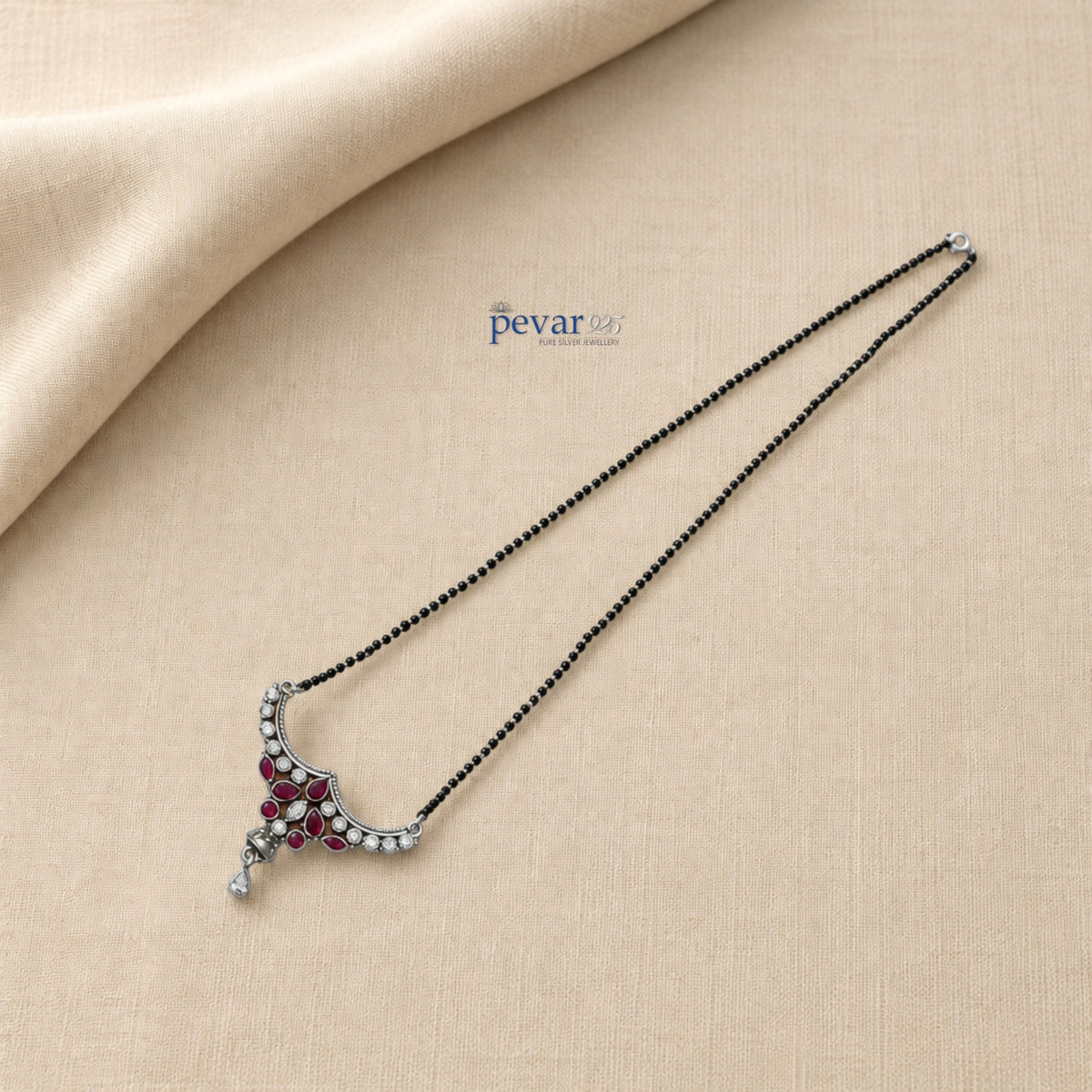 pevar925 oxidized sterling silver mangalsutra with black beads, maroon teardrop stones, and a heritage floral pendant.