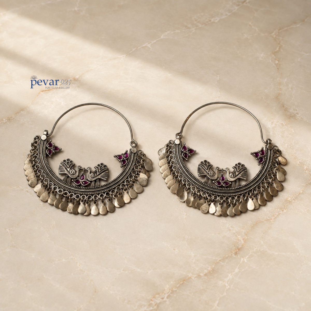 pevar925 oxidized 925 sterling silver Mayuri Chandbali earrings with magenta stone accents and peacock motifs