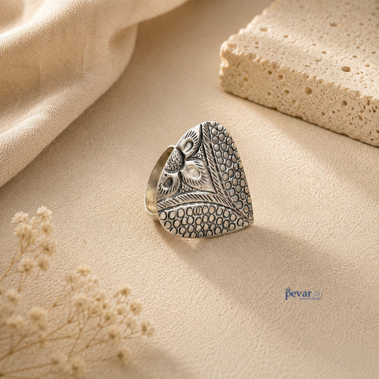pevar925 oxidized silver adjustable ring featuring a handcrafted paan leaf motif with intricate chitai engraving.