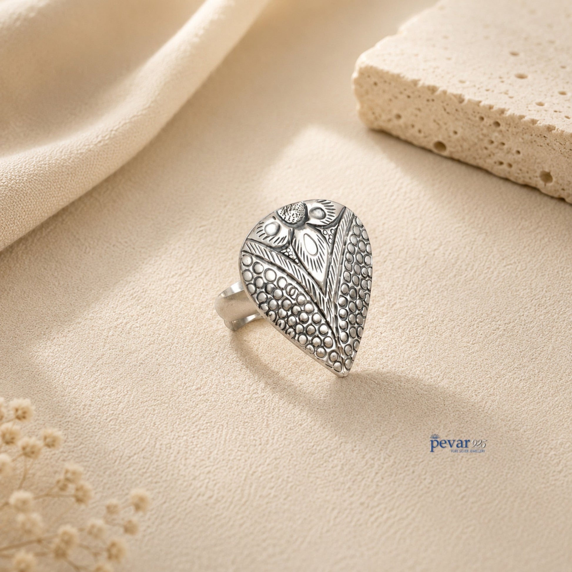 pevar925 oxidized silver adjustable ring featuring a handcrafted paan leaf motif with intricate chitai engraving.