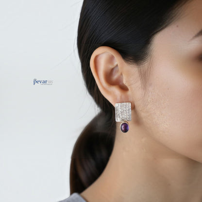 pevar925 oxidized 925 silver rectangular earrings featuring a textured finish and a vibrant purple stone drop