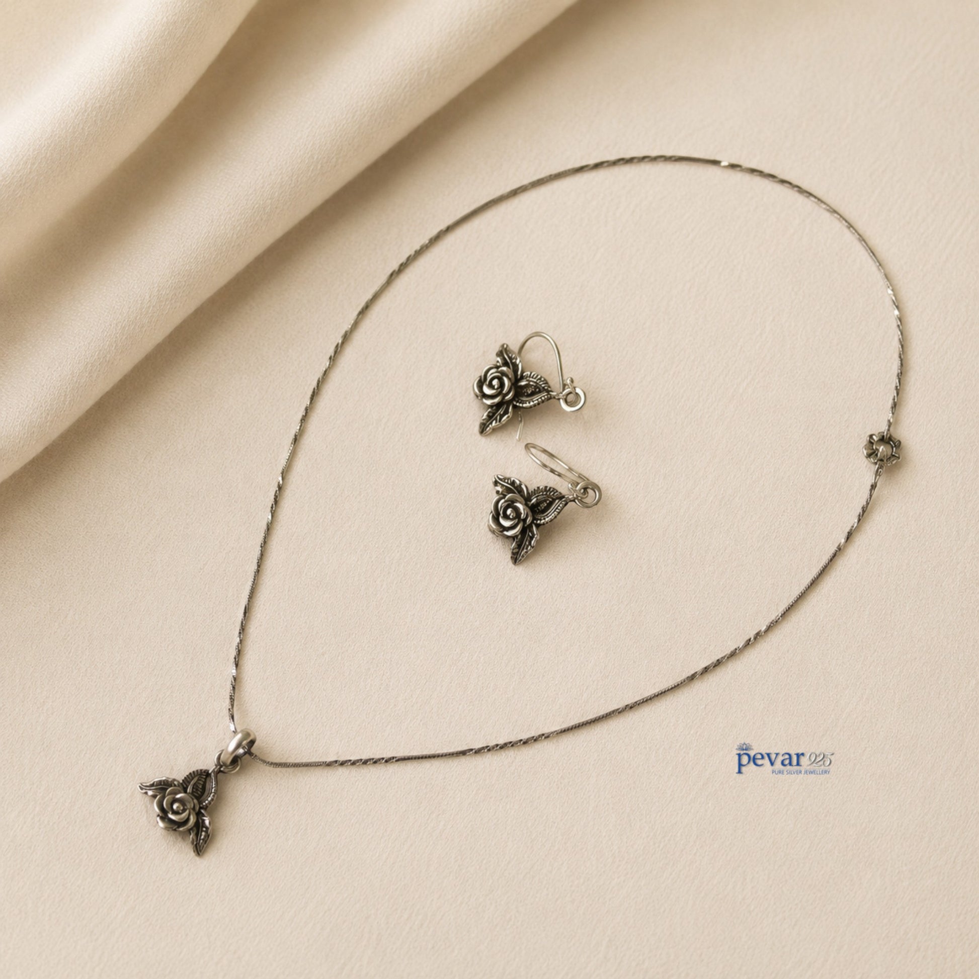 pevar925 oxidized silver rose petal pendant necklace and matching hook earrings with intricate floral detailing