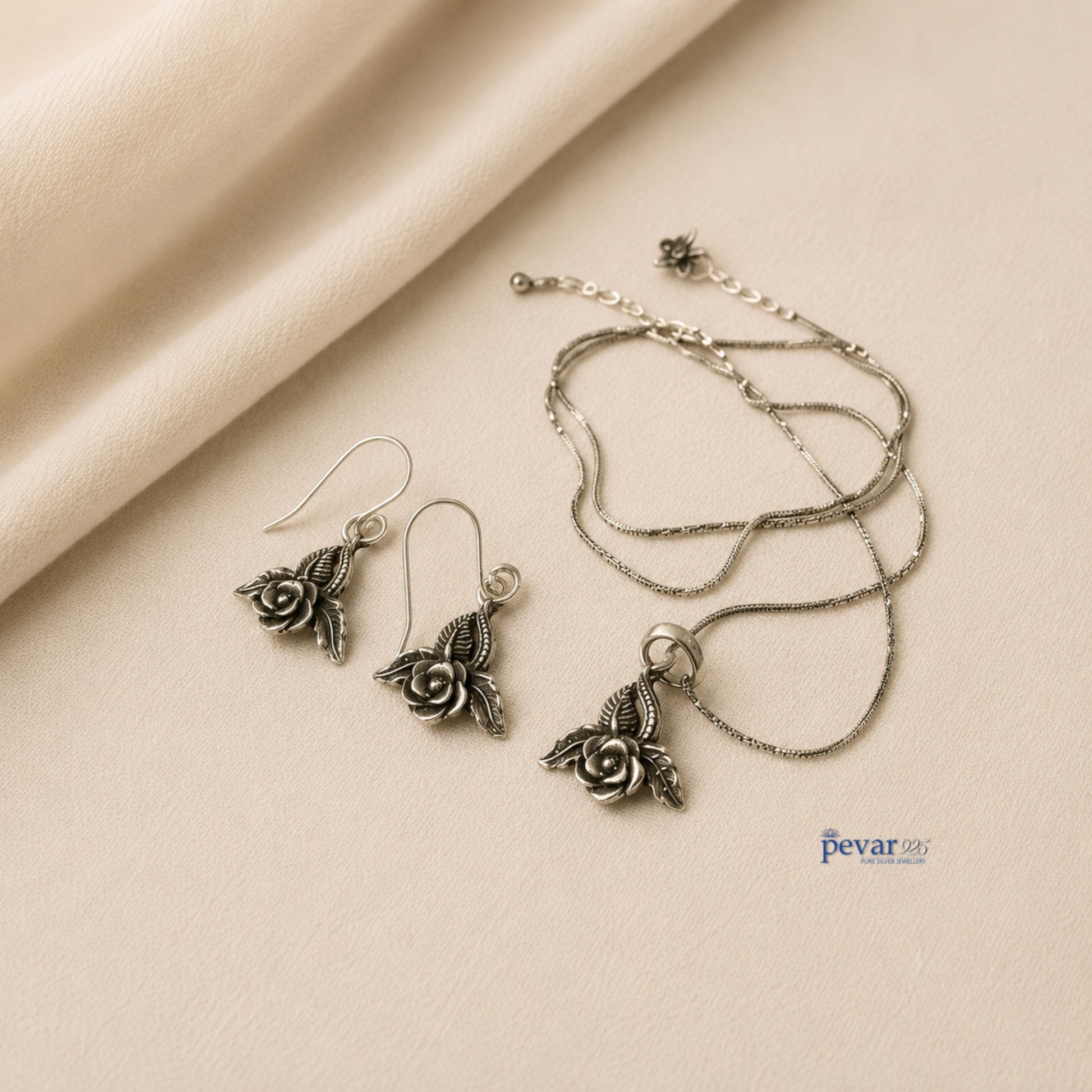 pevar925 oxidized silver rose petal pendant necklace and matching hook earrings with intricate floral detailing