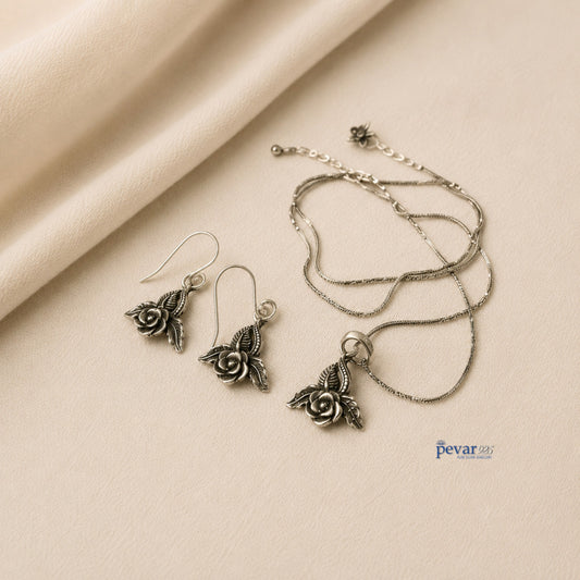 pevar925 oxidized silver rose petal pendant necklace and matching hook earrings with intricate floral detailing