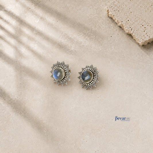 pevar925 oxidized 925 sterling silver stud earrings featuring a sunburst design with a central blue crom stone