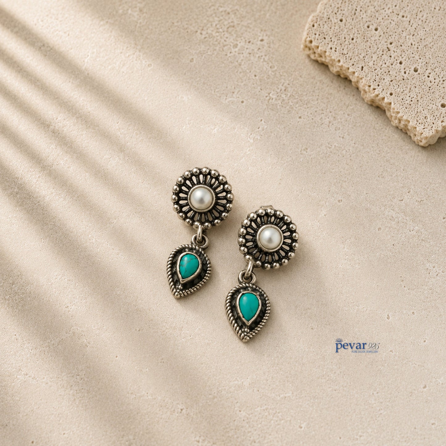 pevar925 oxidized 925 silver earrings featuring a central pearl and a dangling teardrop turquoise stone