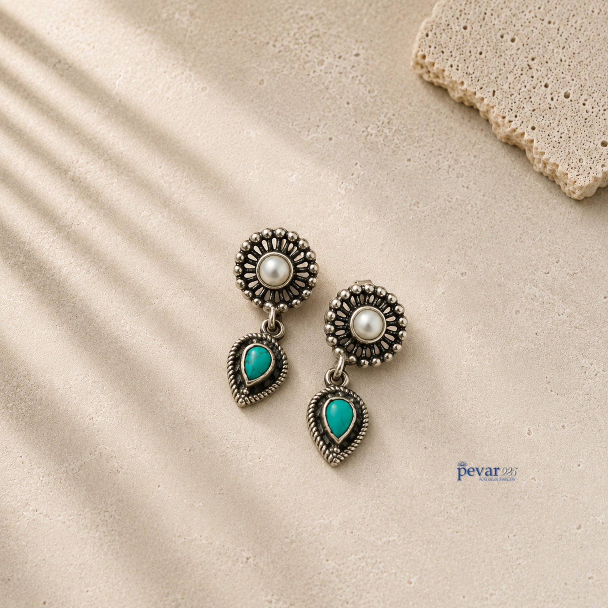pevar925 oxidized 925 silver earrings featuring a central pearl and a dangling teardrop turquoise stone