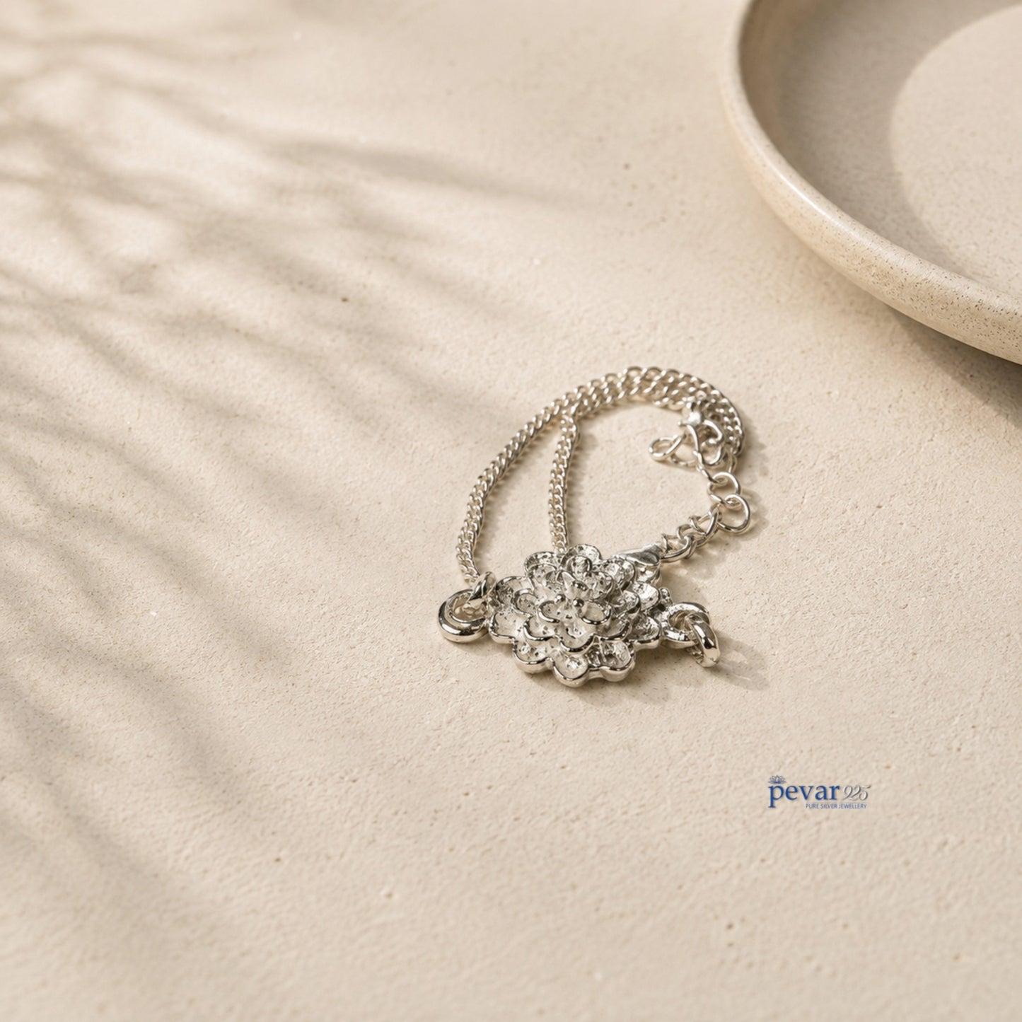 pevar925 sterling silver radiant blossom bracelet with a delicate layered flower charm on a fine chain