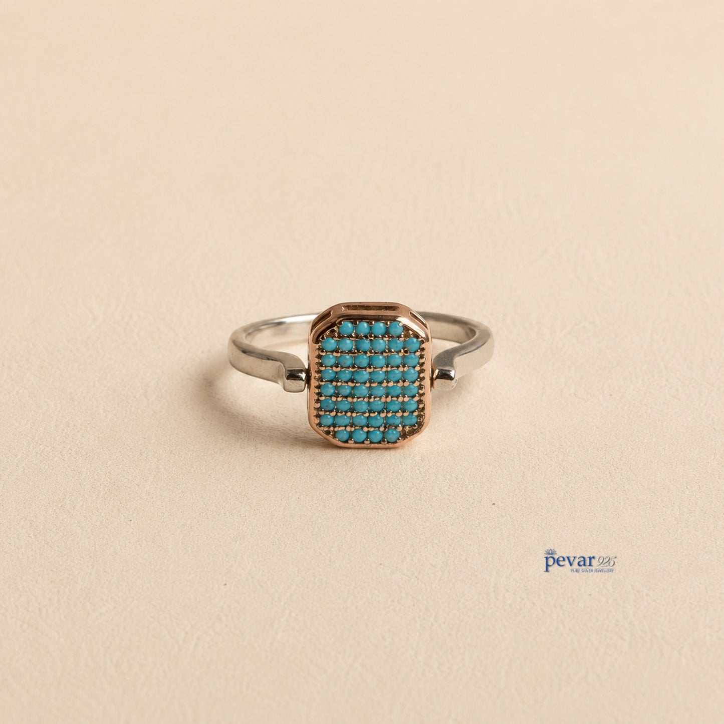 pevar925 sterling silver adjustable flip ring with a rectangular top featuring sky-blue stones and rhodium plating.