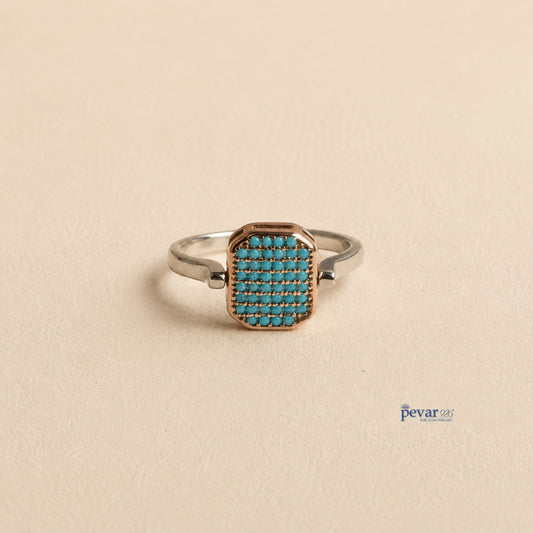 pevar925 sterling silver adjustable flip ring with a rectangular top featuring sky-blue stones and rhodium plating.